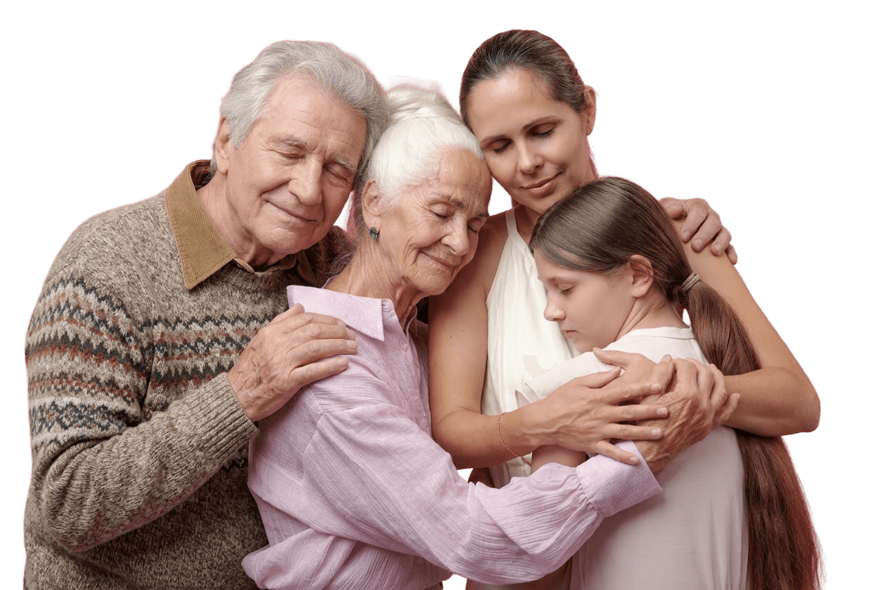 Three generations of a family embracing — grandfather, grandmother, mother and granddaughter